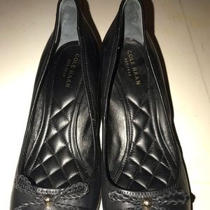 Cole Haan black leather platforms.